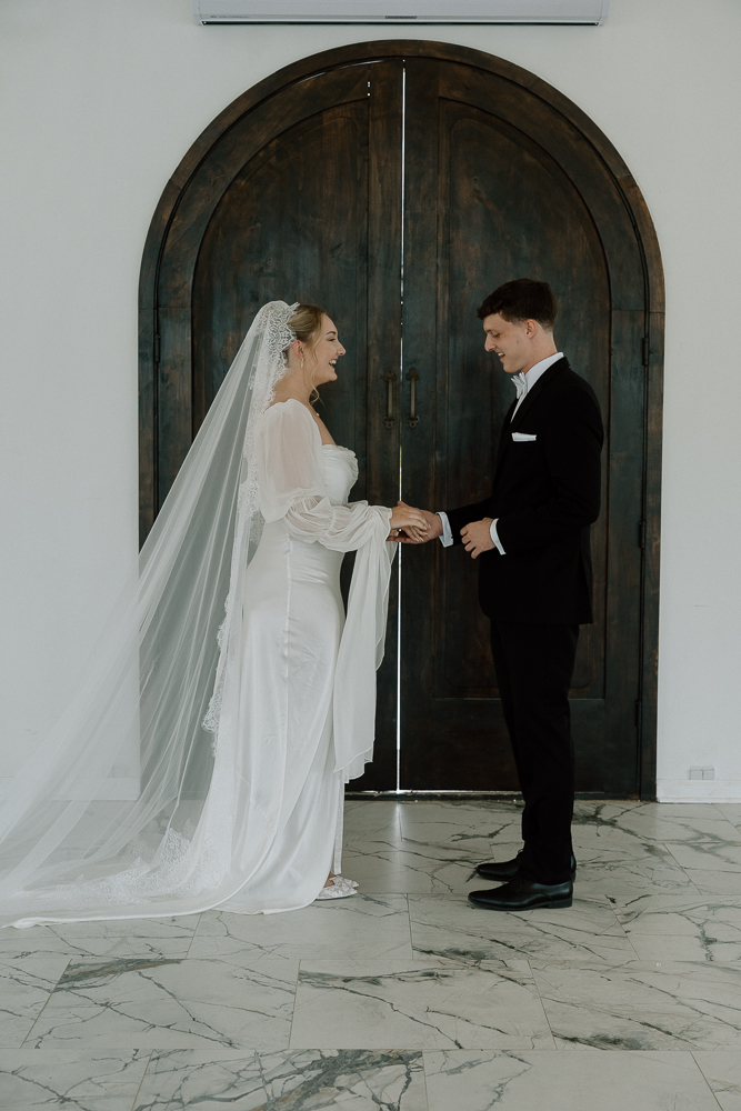 Groom emotional, seeing the bride in her wedding dress