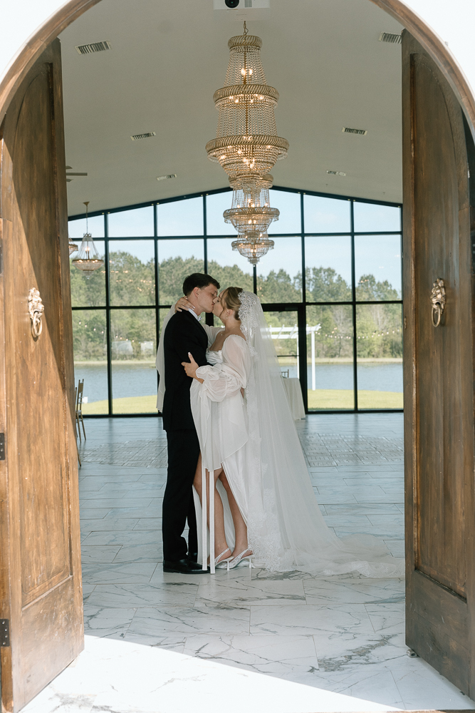 portrait of the bride and groom kissing