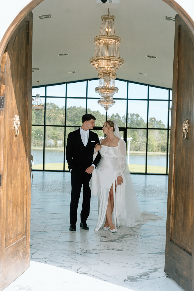 Picture of the bride and groom holding hands