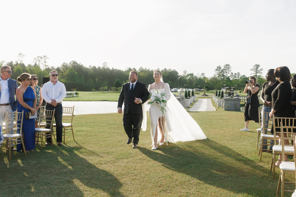 Cute picture of the bride and her dad walking down the aisle