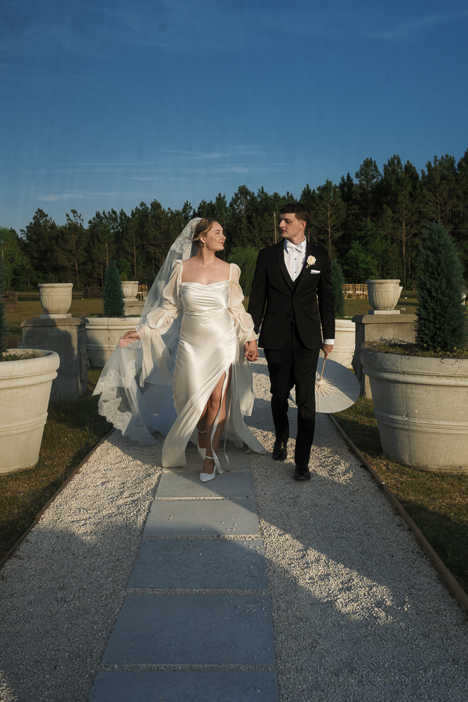 couple holding hands during their bridal portraits