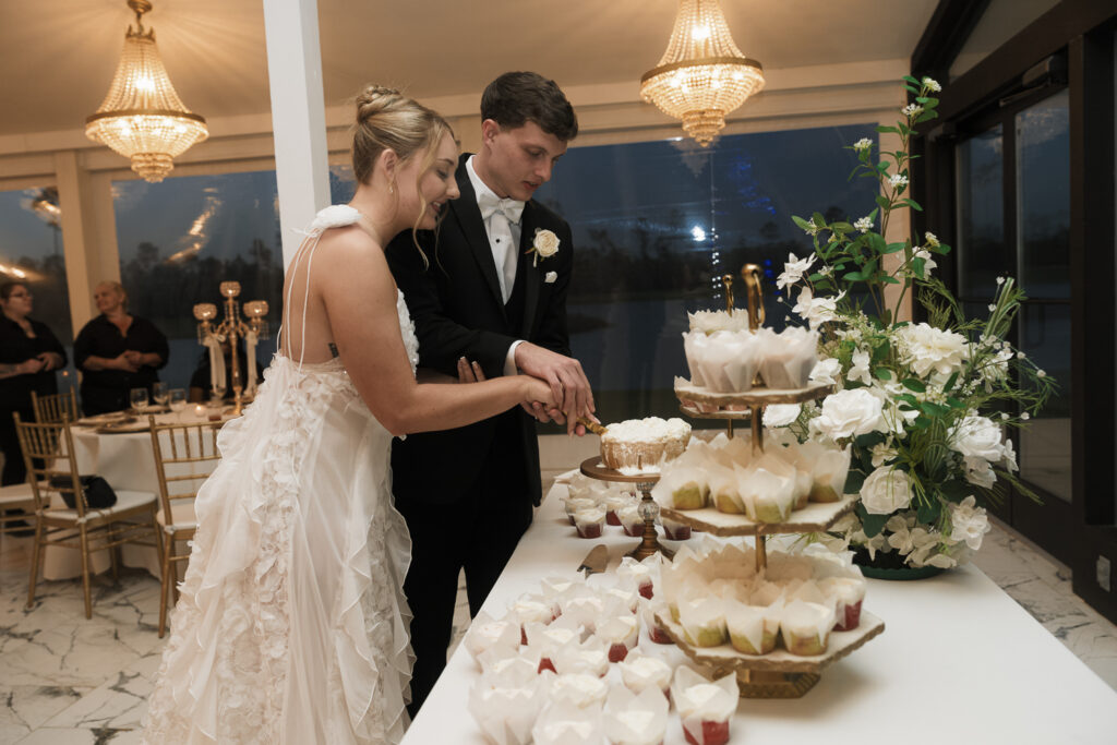 Picture of the newlyweds cutting their wedding cake