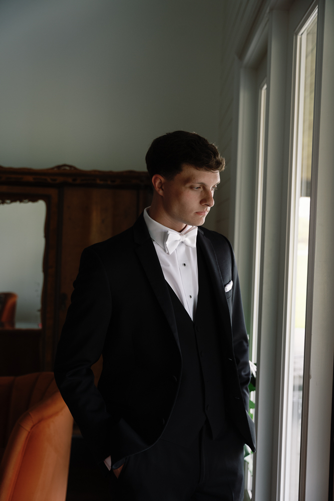 Portrait of the groom before his first look with the bride