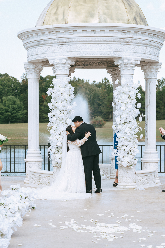 bride and groom kissing after their ceremony