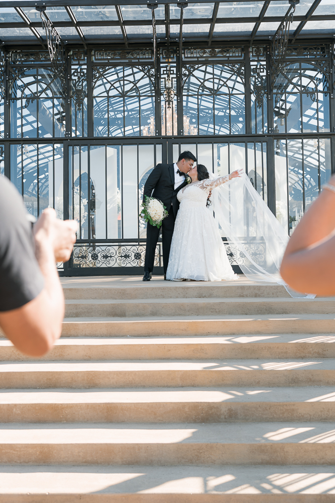 cute picture of the newlyweds kissing 