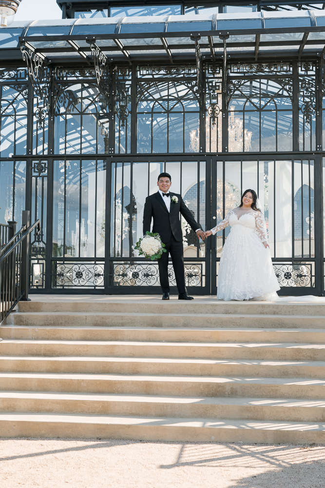 cute picture of the bride and groom holding hands