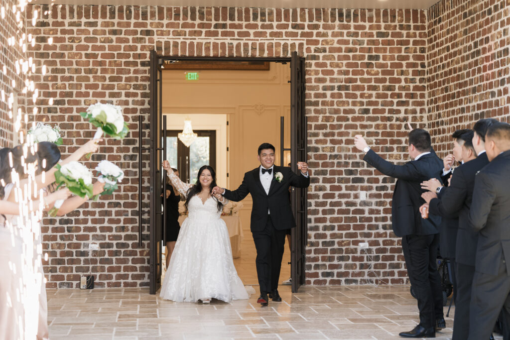couple entering their wedding reception