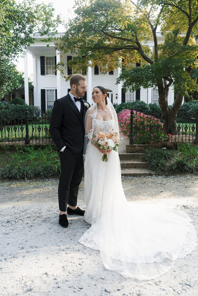 portrait of the bride and groom laughing with each other