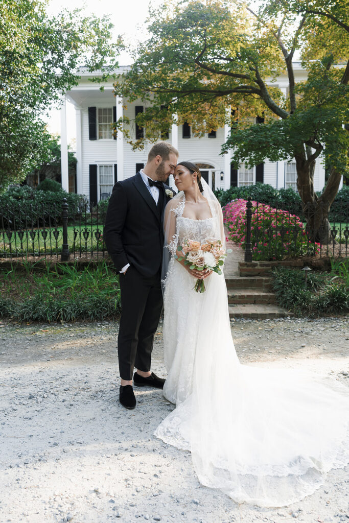 groom kissing the bride on the forehead