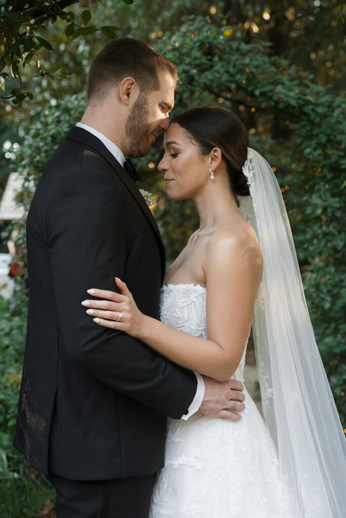 groom kissing the bride on the forehead