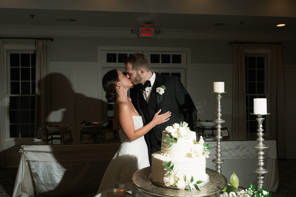 newly married couple trying their wedding cake