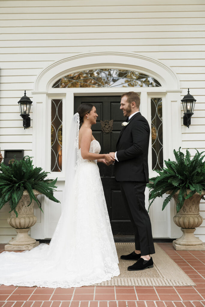 portrait of the newlyweds holding hands