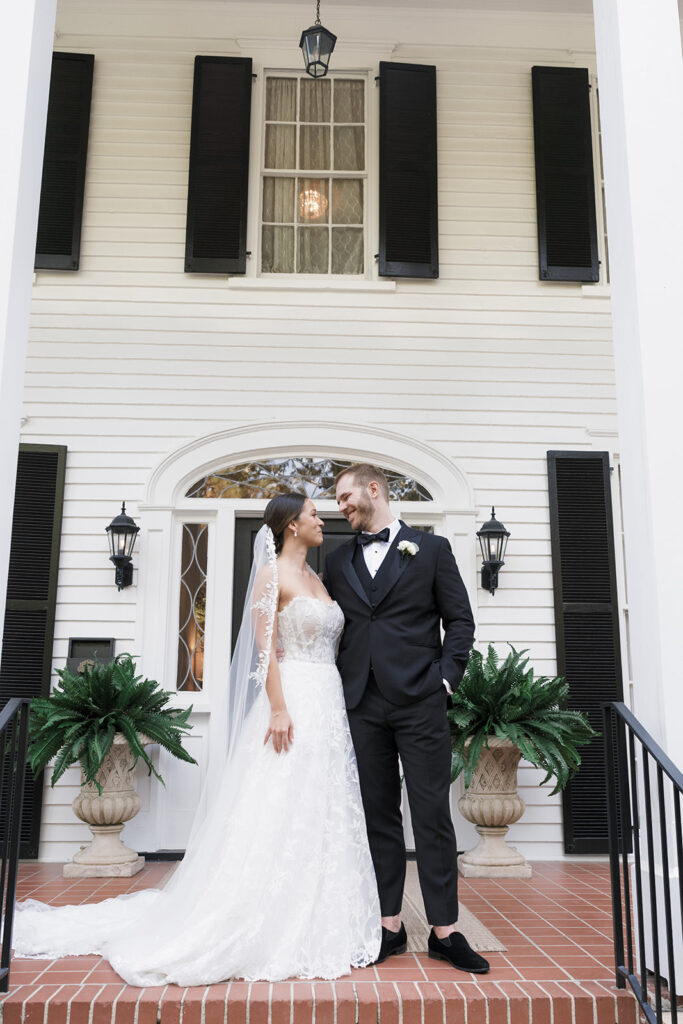 cute portrait of the bride and groom smiling at each other