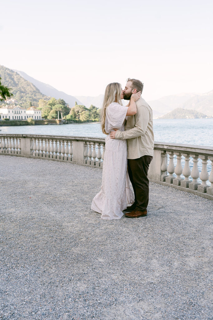 cute picture of the couple kissing during their photoshoot
