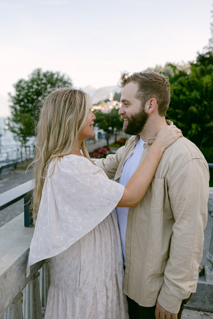 cute picture of the newly engaged couple smiling at each other