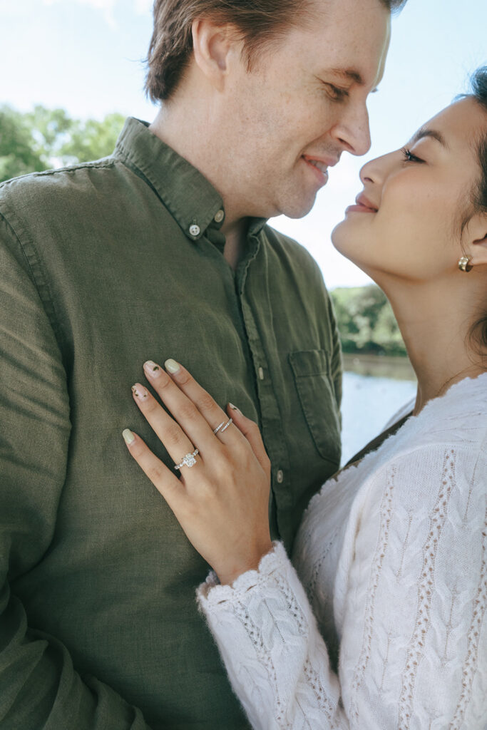 cute couple laughing with each other during their session