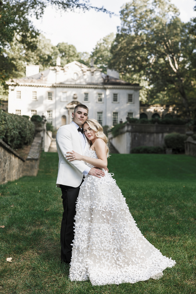 couple smiling at the camera during their photoshoot