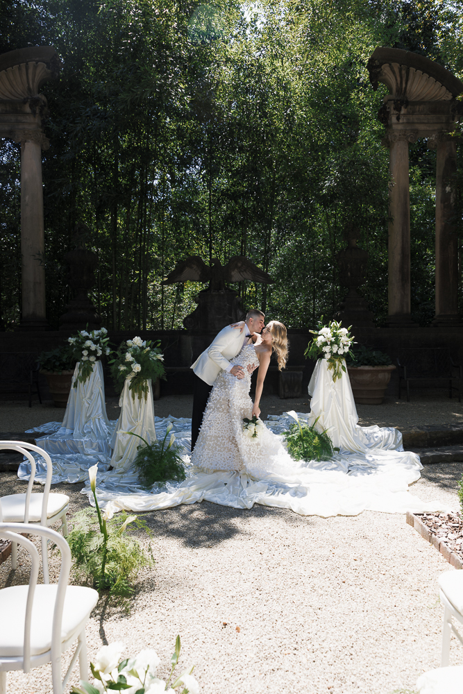 bride and groom kissing after their ceremony