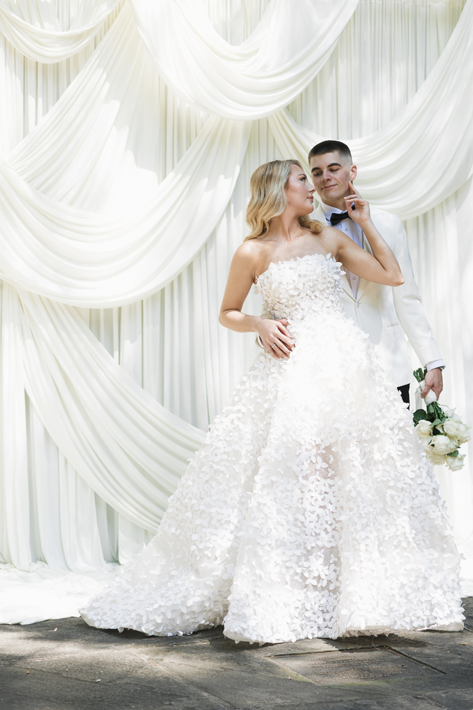 cute picture of the bride and groom smiling at each other