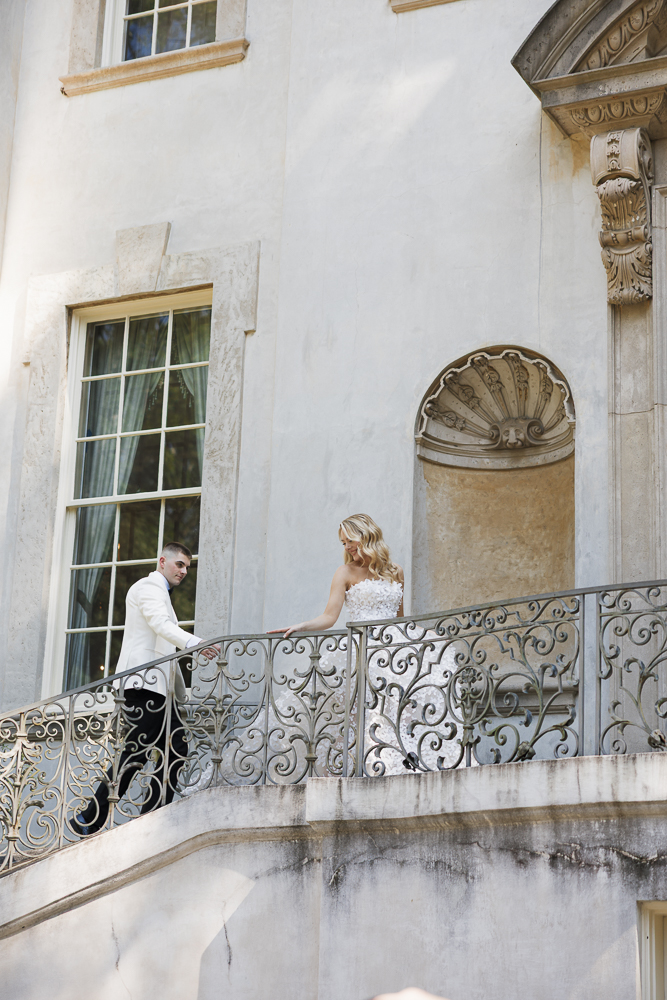 portrait of the bride and groom holding hands