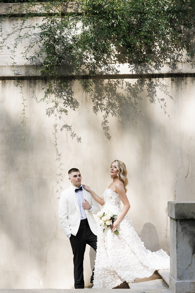 bride and groom laughing with each other 
