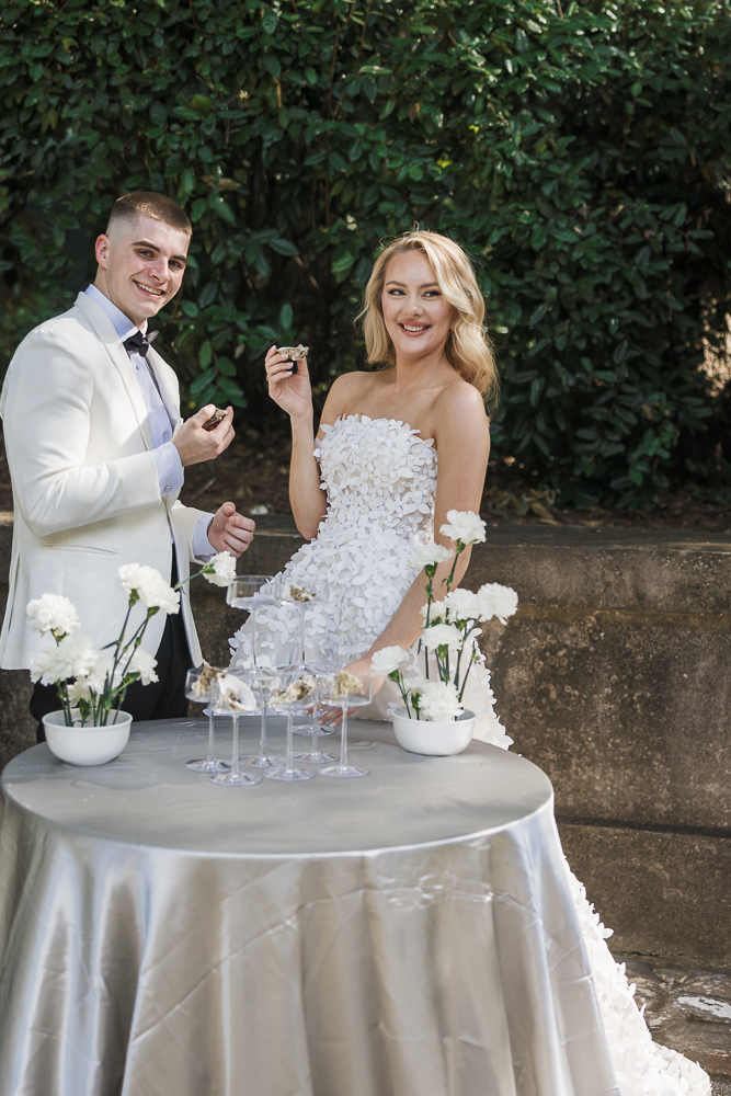newlyweds having oysters at their reception