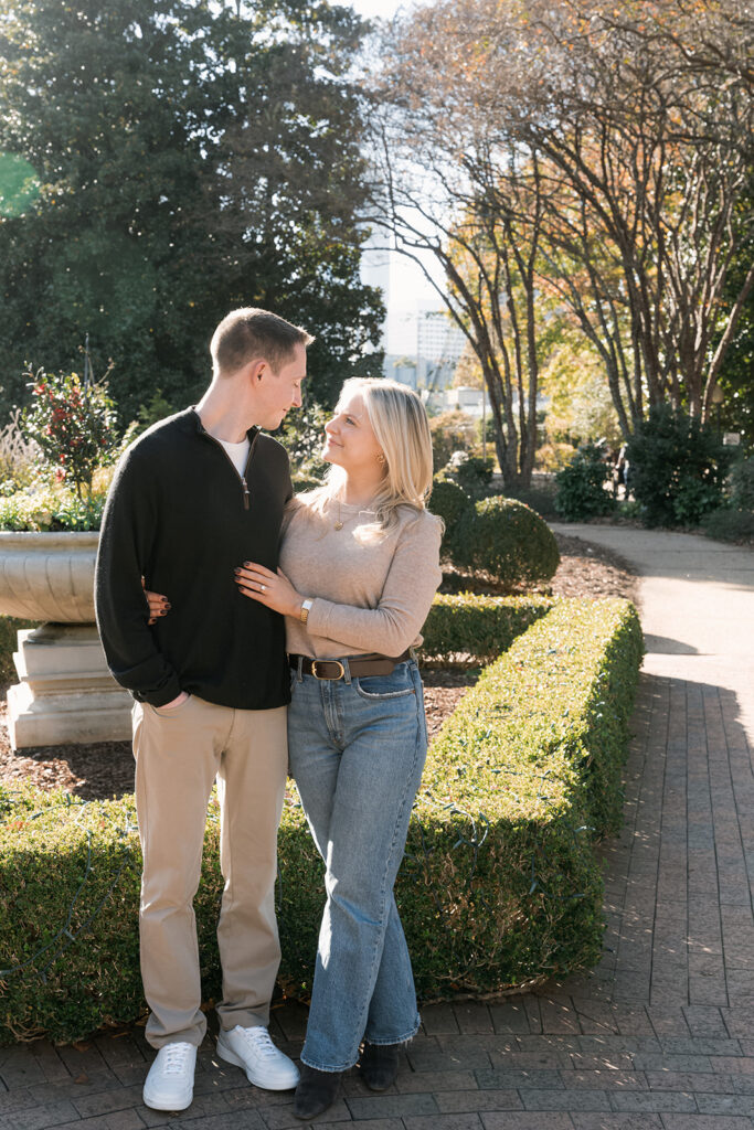 cute portrait of the newly engaged couple smiling at each other