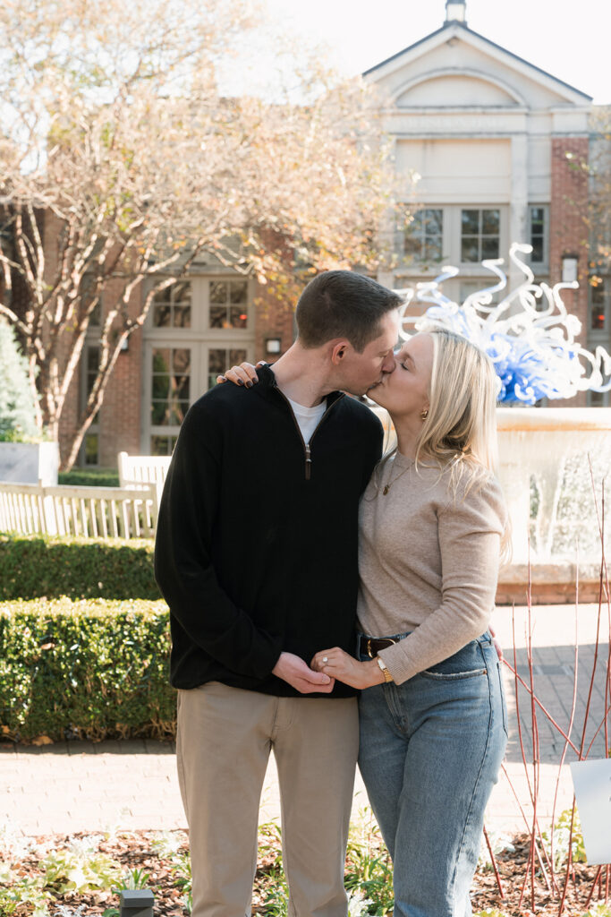 portrait of the newly engaged couple kissing