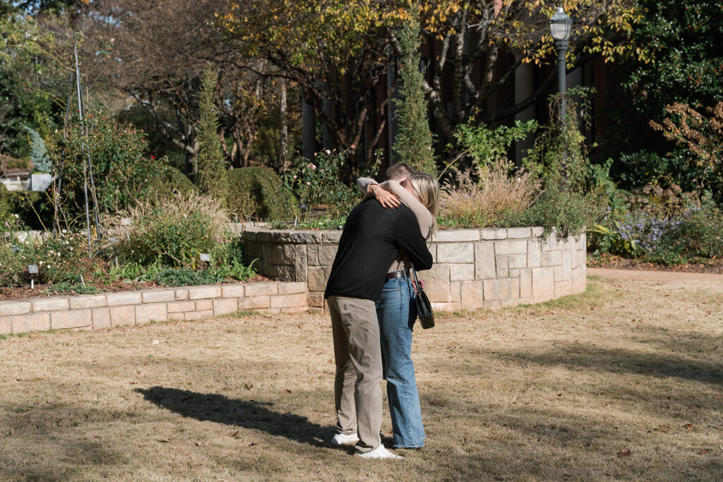 cute portrait of the couple hugging after their proposal