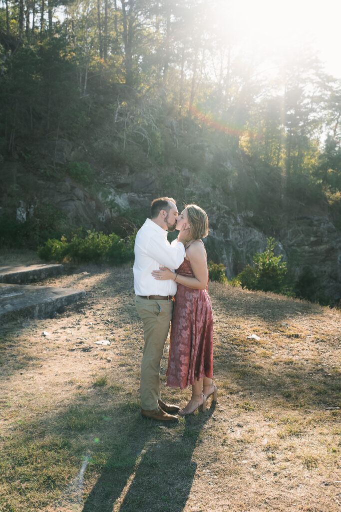 portrait of the newly engaged couple kissing