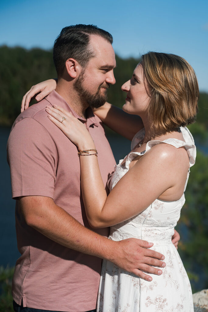 cute picture of the newly engaged couple smiling at each other