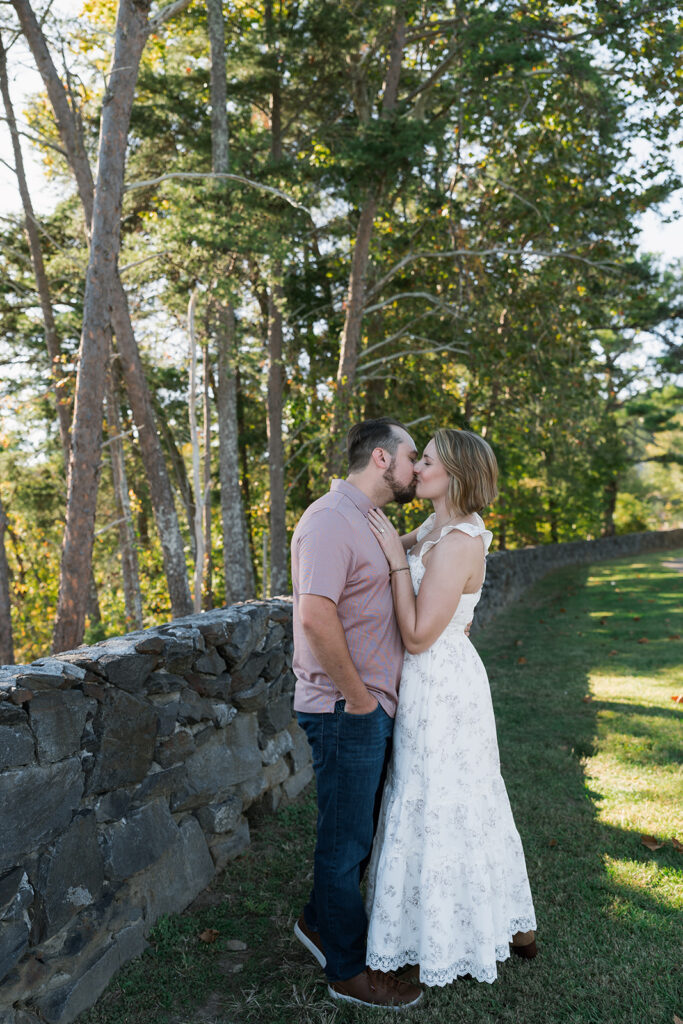 Cute picture of the newly engaged, couple kissing