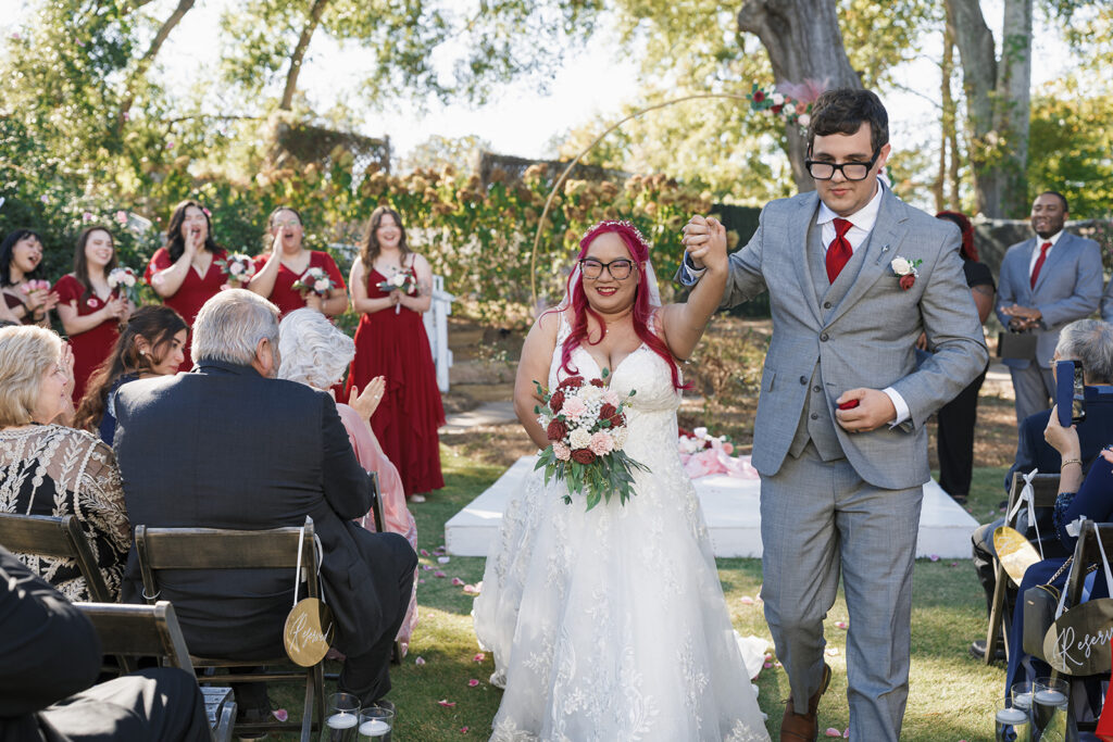 cute picture of the newlyweds heading to their wedding reception