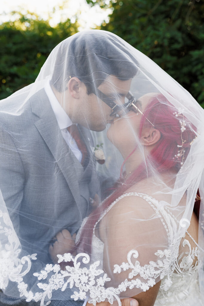 portrait of the bride and groom kissing