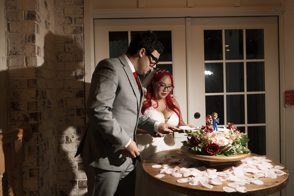 newlyweds cutting their wedding cake