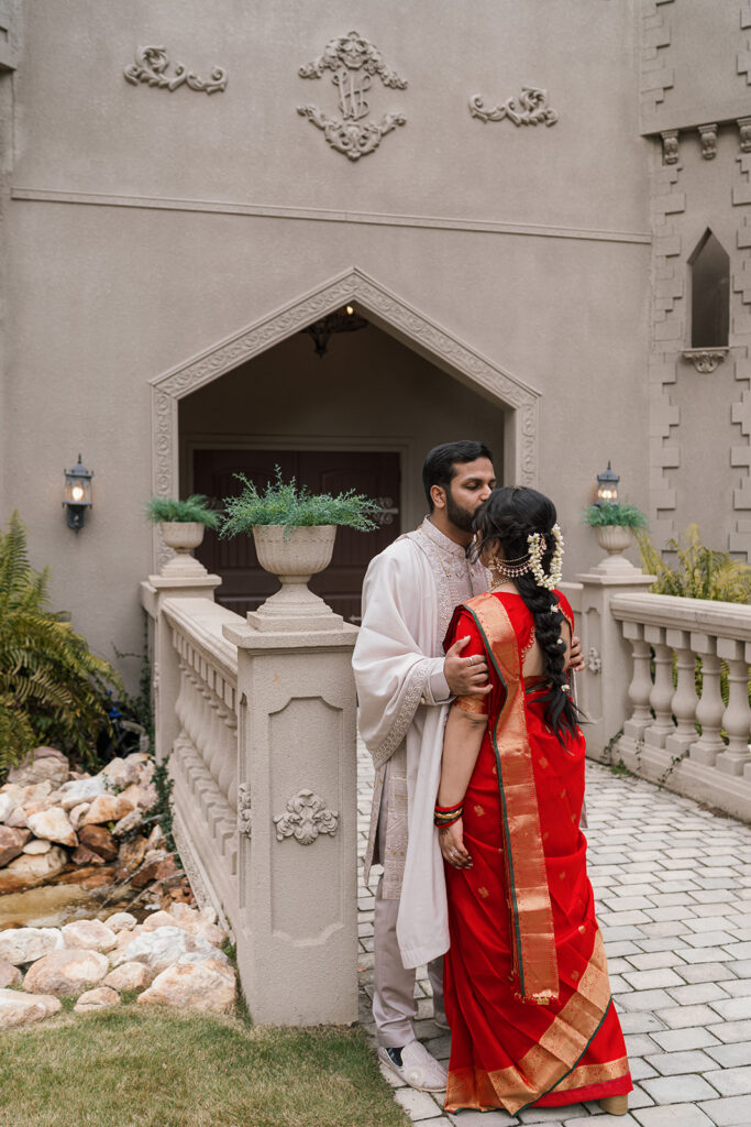 groom kissing the bride on the forehead