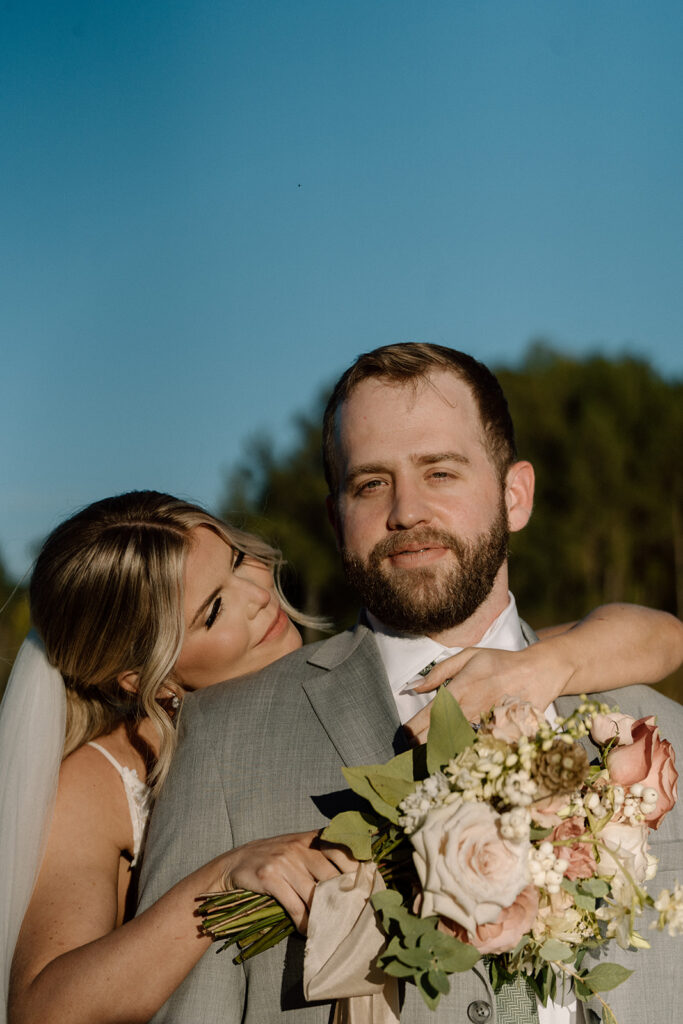 bride kissing the groom on the cheek