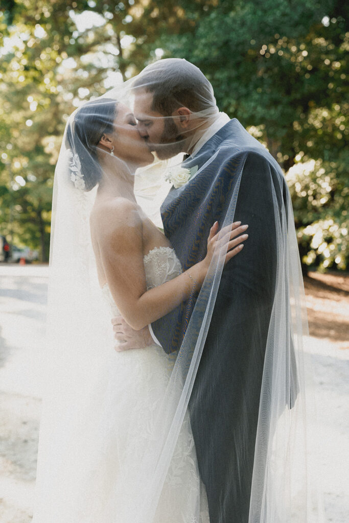 cute picture of the newlyweds kissing