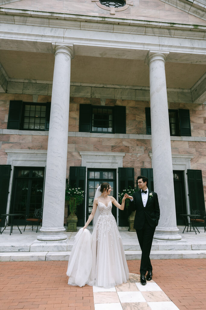 cute picture of the bride and groom holding hands