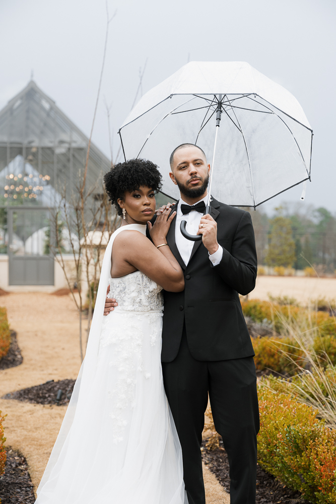 Couple smiling at the camera during their bridal portraits