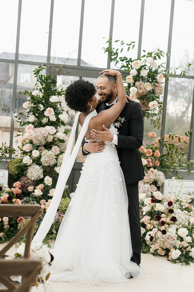 Portrait of the bride and groom hugging