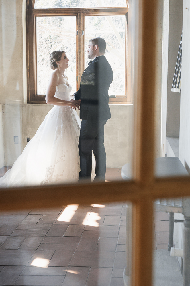 Cute picture of the bride and groom holding hands