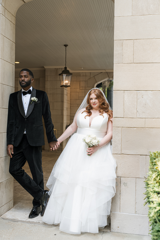 beautiful picture of the bride and groom holding hands