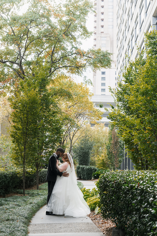 picture of the newlyweds hugging during their photoshoot