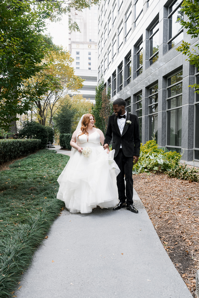 cute picture of the bride and groom holding hands