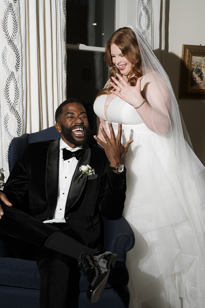 picture of the newlyweds showing their wedding rings