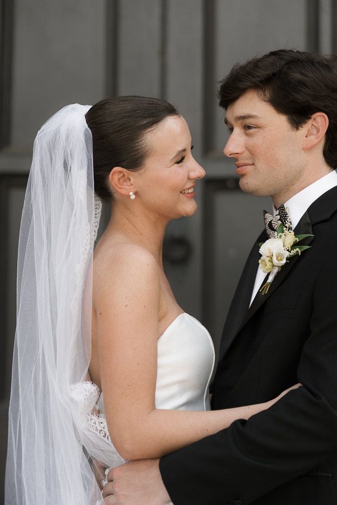 cute picture of the bride and groom smiling at each other