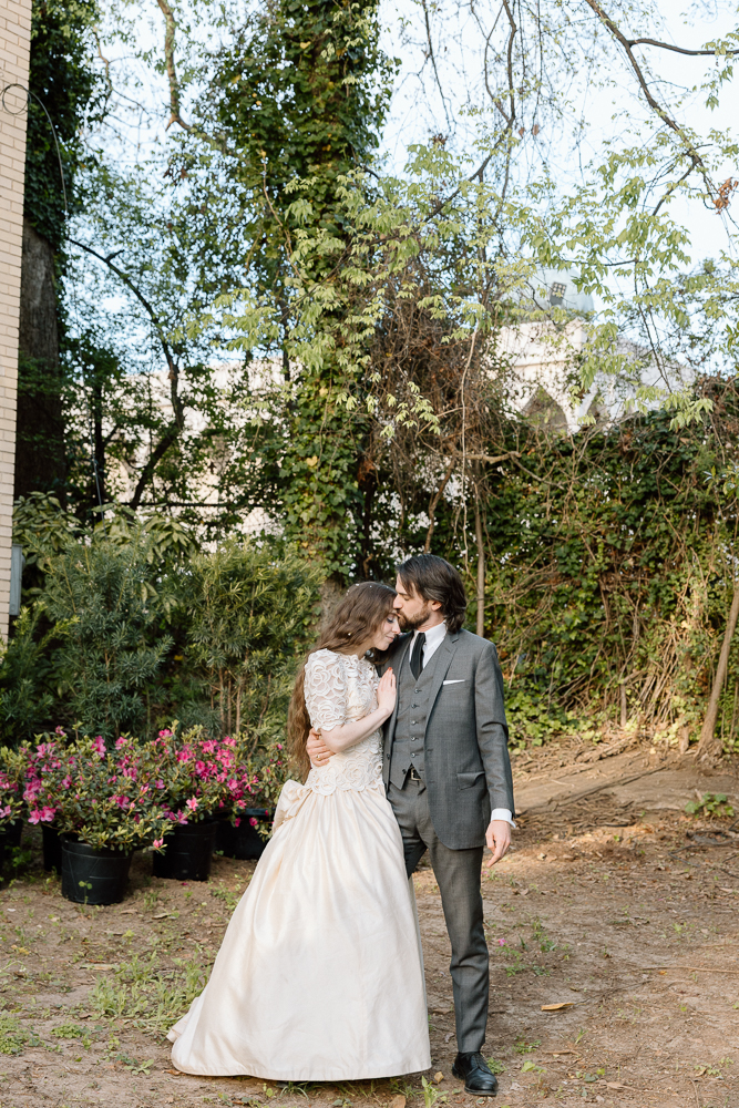 groom kissing the bride on the forehead
