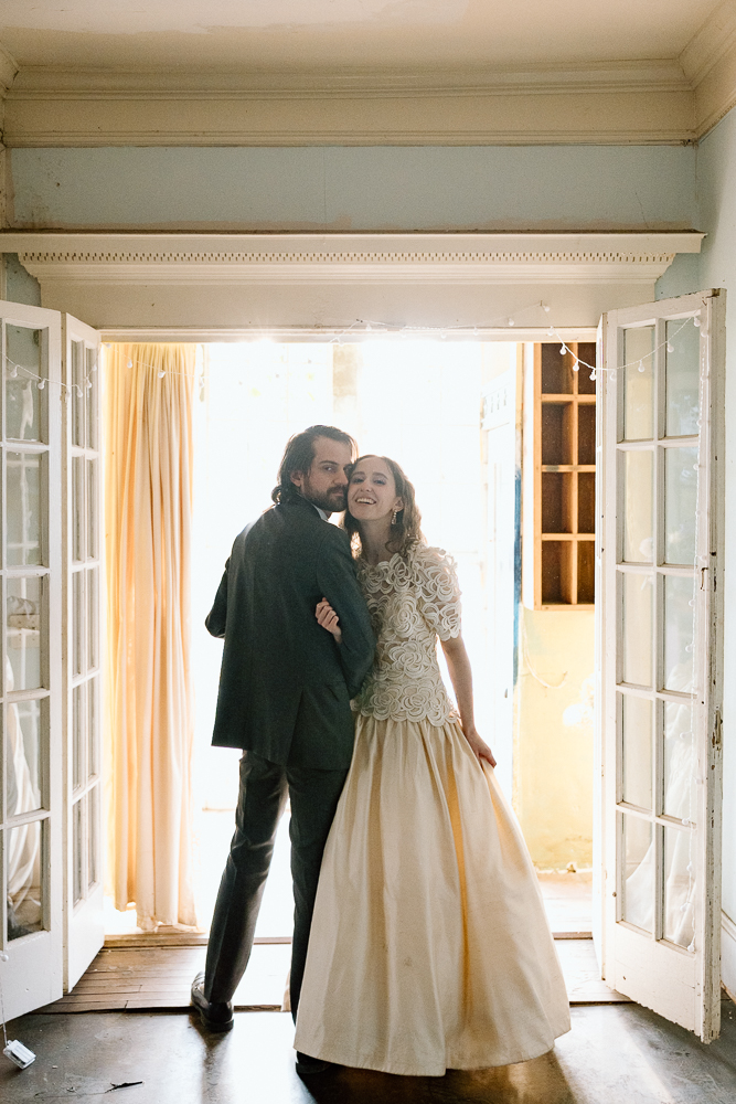 groom kissing the bride on the cheek