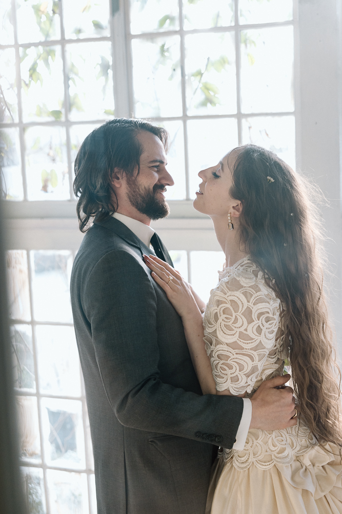 bride and groom laughing with each other